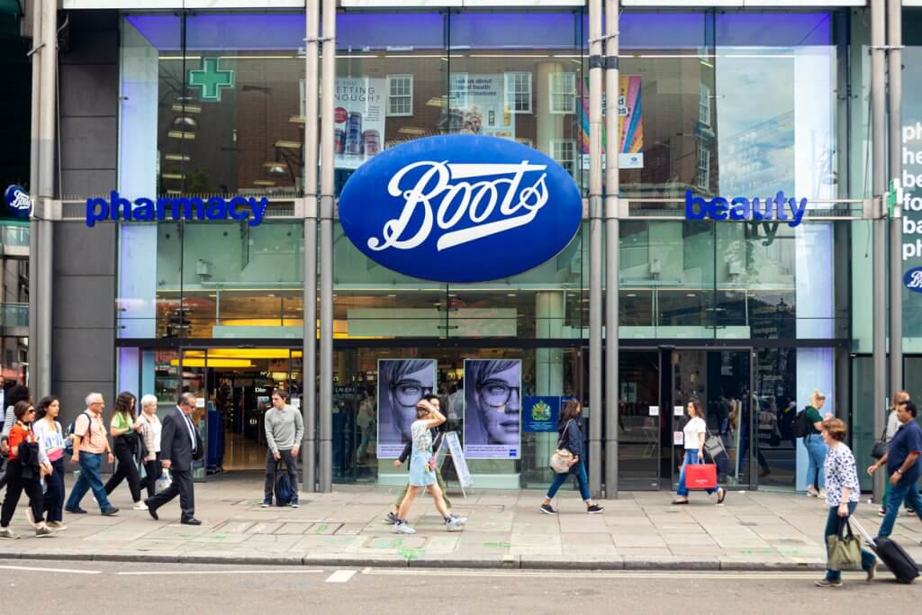 People walking in front of the Boots pharmacy in London